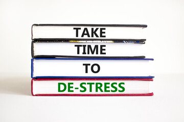 Take time to de-stress symbol. Concept words Take time to de-stress on books on a beautiful white table white background. Psychological business and take time to de-stress concept. Copy space.