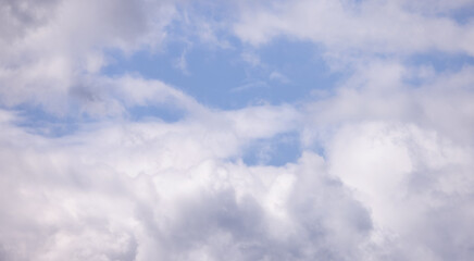 View of Cloudscape during a cloudy blue sky sunny day. Taken on the West Coast of British Columbia, Canada.