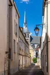 Fototapeta na wymiar Provins, France - May 31, 2020: Street scene with old houses in the medieval town of Provins, Seine-et-Marne department, Ile-de-France region
