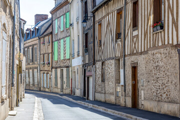 Provins, France - May 31, 2020: Street scene with old houses in the medieval town of Provins,  Seine-et-Marne department, Ile-de-France region