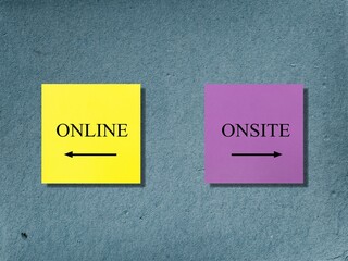 Yellow and pink note on wall with text and direction to ONLINE and ONSITE, concept of education and...