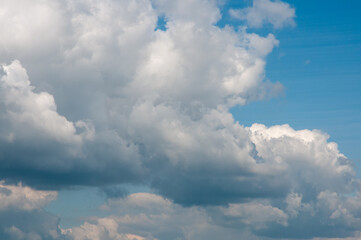 Fototapeta na wymiar Cloudy skies in sunshine on summer day. Sky sun clouds atmospheric cloud background.