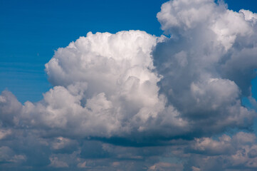 Naklejka na ściany i meble Cloudy skies on summer day. Atmospheric sky in clouds.