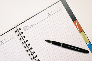 A fountain pen and paper for notes and memos. For new plans for the new year. Pen and paper for studying.