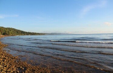 Layer of gentle waves of the ocean in the morning sun, Sogod, Cebu, Philippines