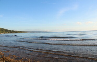 Layer of gentle waves of the ocean in the morning sun, Sogod, Cebu, Philippines