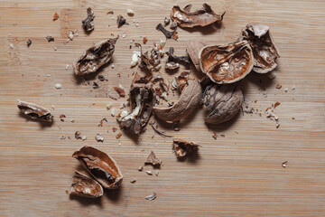 Shelled walnut . Peeled nut shell , wooden background 