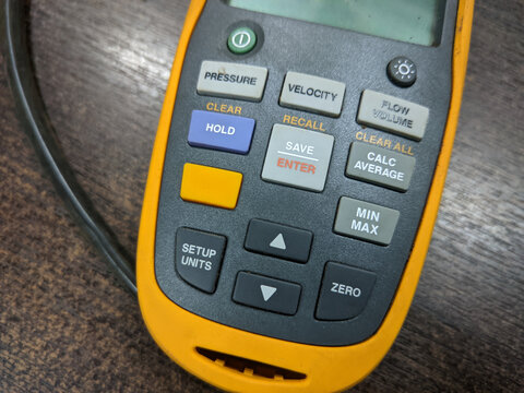 Malaysia,6 June 2022: Fluke 922 Airflow Micromanometer with Bright Backlit Display on a table.