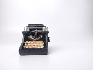 Black vintage typewritter on a white background.