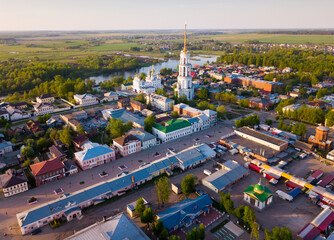 Scenic view from drone of Shuya cityscape on bank of Teza River with Resurrection Cathedral and belfry, Russia