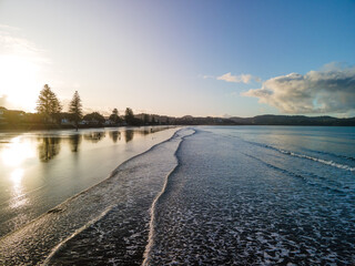 Sunset along Orewa beach on New Zealand's Hibiscus coast - obrazy, fototapety, plakaty