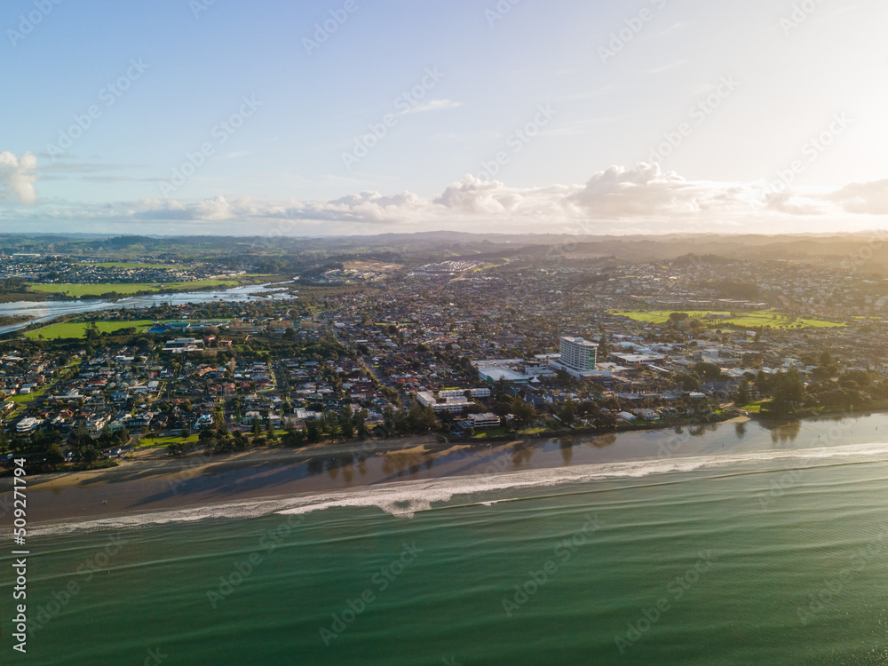 Wall mural Sunset along Orewa beach on New Zealand's Hibiscus coast