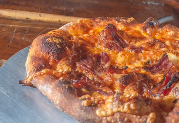 Homemade Italian pizza with natural fermentation, various flavors among them pastrami, bacon and pulled pork,pizza concept