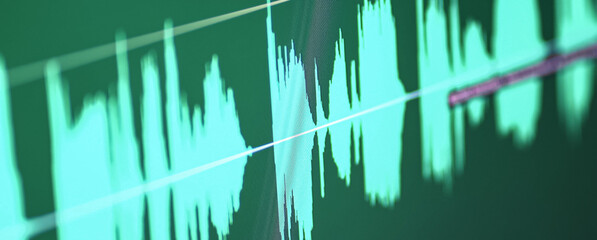 Audio specturm green color. Recording studio. Computer screen.