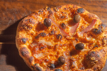 Homemade Italian pizza with natural fermentation, various flavors among them pastrami, bacon and pulled pork,pizza concept