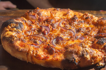 Homemade Italian pizza with natural fermentation, various flavors among them pastrami, bacon and pulled pork,pizza concept