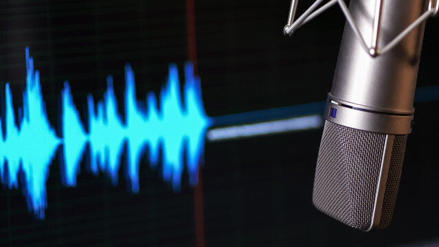 Audio specturm blue color. Recording studio. Computer screen and condenser mic.