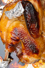 top view the left half of a fresh baked home-made chicken just came out from an oven vertical composition