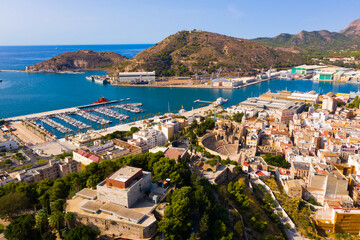 Obraz premium Picturesque summer view from drone of coastal Spanish town of Cartagena overlooking harbor with fleet of yachts