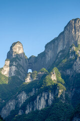 Fototapeta na wymiar Cable cars going on top of the Tianmen mountain, Zhangjiajie, China, vertical image, blue sky with copy space for text