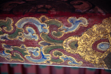Background pattern of the woodwork on the Chinese temple, blue, golden, green paint