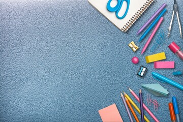 School stationery, color pencils, notepad on table. Back to school concept.