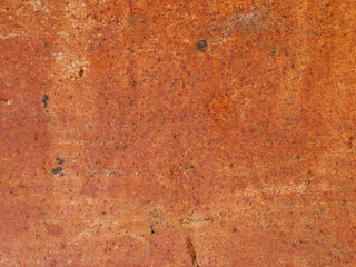 Old grunge rusty metal wall, detail of weathered iron textured background, poor condition orange surface