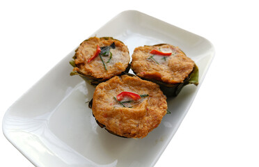 Thai steamed fish with curry paste (Ho mok) on white plate, isolated on white background with clipping path