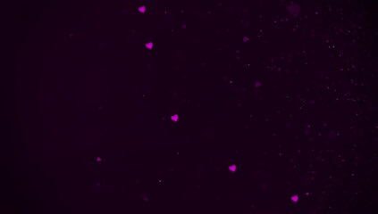 Purple heart bokeh glitter on black background.
