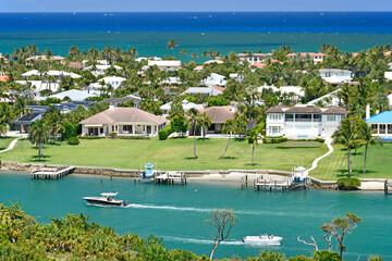 Aerial view of luxury waterfront homes along the intracoastal near Jupiter Inlet from the lighthouse in Jupiter, Florida in Palm Beach County - obrazy, fototapety, plakaty