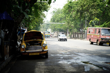 Kolkata Street and Yellow Taxi Waiting for Passenger
