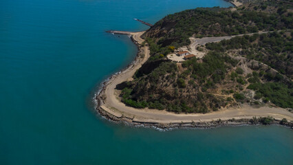 Fototapeta premium Drone photos of El Morro hill, recorded in the middle of a sunny morning, in the videos you can see, El Morro hill, hills, mountains, coasts, roads, trees on the shore of the beach, beach, rocks, sand