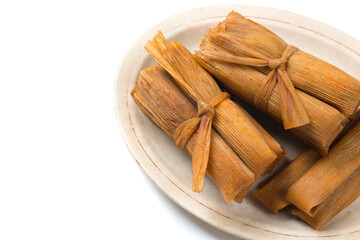 Isolated Tamales in Corn Husks