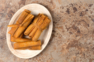 Isolated Tamales in Corn Husks