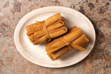 Isolated Tamales in Corn Husks
