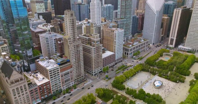 Fantastic Millennium Park with Cloud Gate sculpture. Wonderful Chicago architecture surrounding green area.