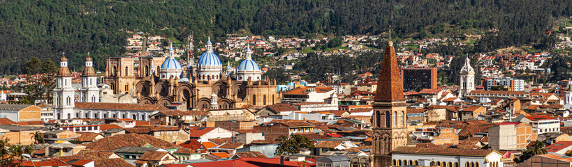 Panoramic view of the historical center of city Cuenca at the valley with its many churches....