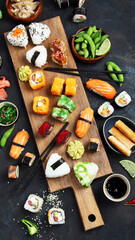 Japanese food assortment on dark background.