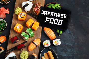 Japanese food assortment on dark background.