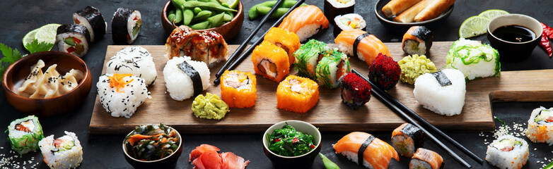 Japanese food assortment on dark background.