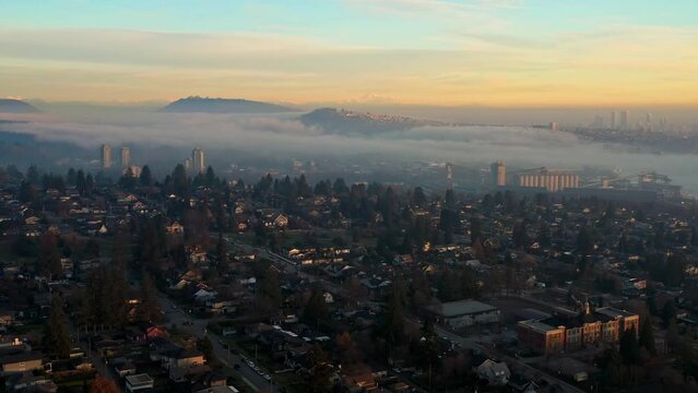 Clouds And Fog Over The North Vancouver City In British Columbia, Canada. - aerial pullback