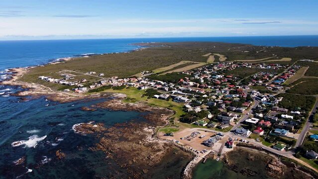 Kleinbaai and its harbour, heart of shark cage diving industry; aerial pan