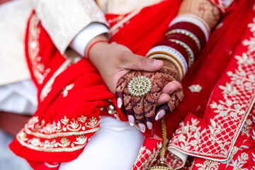 Indian Punjabi bride's hands with a wedding ring close up