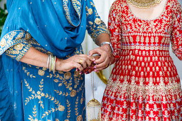 Fototapeta na wymiar Indian Punjabi bride's red wedding bangles close up