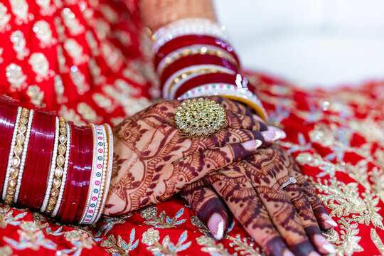 Indian Punjabi bride's hands with a wedding ring close up
