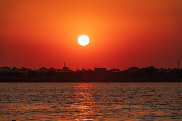 The sun goes down over a lake