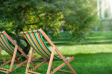 A garden chair. Summer vacation in green surroundings. Happy outdoors relaxing. Outdoor leisure