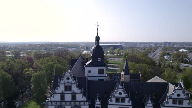 zoom out from clock tower to whole castle and surroundings in Wolfsburg