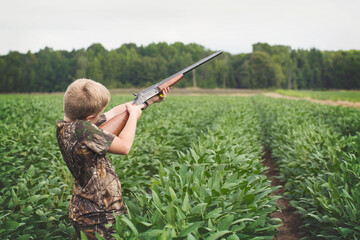 Boy With Shotgun While Dove Hunting