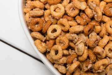 Heart Shaped Bowl of Cinnamon Flavored O Shaped Cereal and Oats